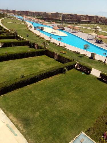 an aerial view of a park with two swimming pools at Chalet Marina Wadi Degla Families Only Pool view 2nd floor with Roof 6 adults in Ain Sokhna