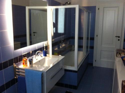 a bathroom with a sink and a mirror at Villa con piscina in Canale Monterano