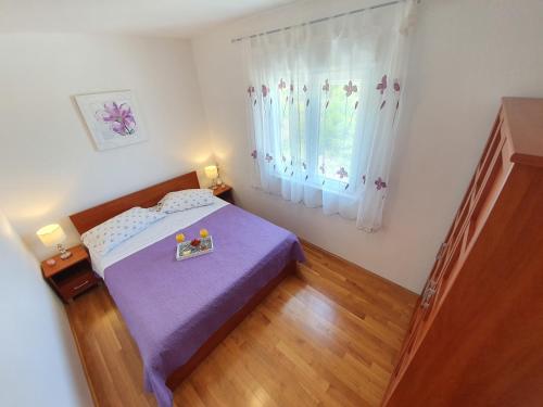 Postel nebo postele na pokoji v ubytování Apartment Tihana