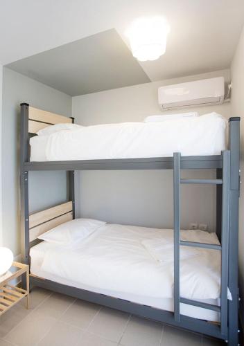 two bunk beds in a room at Snooze H in Athens