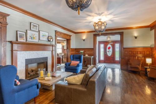 a living room with a couch and a fireplace at The Shore House in Narragansett