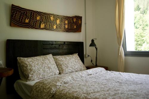 Кровать или кровати в номере Un coccodrillo a FrAsSiNo