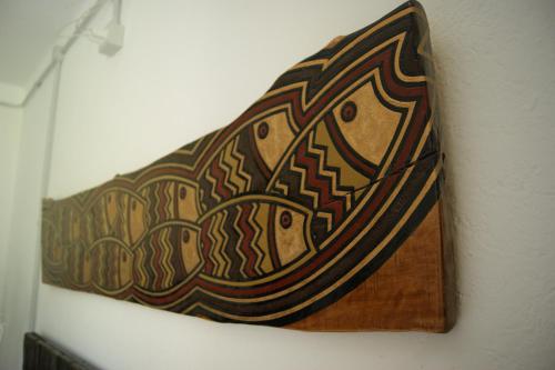 a wooden tie hanging on a wall at Un coccodrillo a FrAsSiNo in Calizzano
