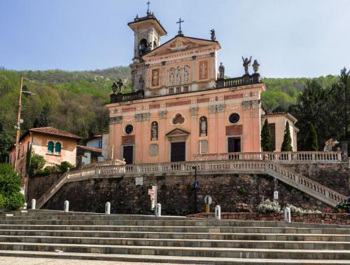 an old building with stairs in front of it at Villa Rina Deluxe and Cottage in Porto Ceresio