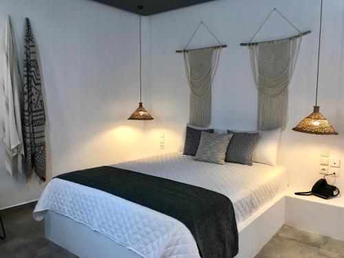 Postel nebo postele na pokoji v ubytování AELLIA HOTEL & SUITES LEROS