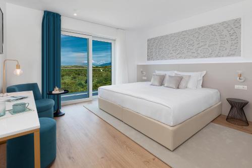 Кровать или кровати в номере Hotel In Excelsis