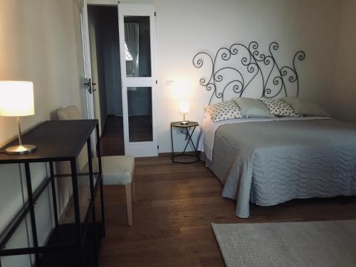 Ein Bett oder Betten in einem Zimmer der Unterkunft Est Locanda