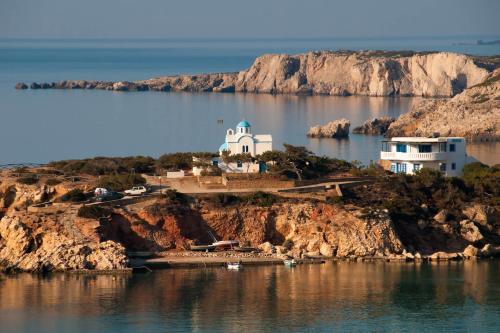 a house on an island in a body of water at Aelia Luxury Villa in Amoopi