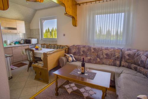 a living room with a couch and a table at Vuković Accommodation in Žabljak