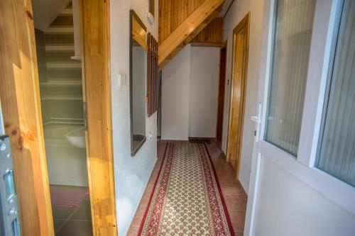 a hallway of a house with a tile floor at Vuković Accommodation in Žabljak