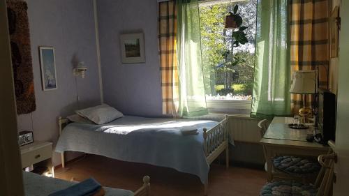 Postel nebo postele na pokoji v ubytování Motelli Nuttulinna