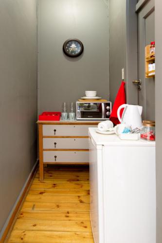 a small kitchen with a counter and a microwave at Studio Gray in Benoni
