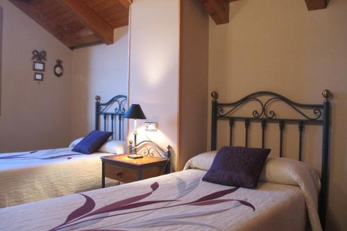 A bed or beds in a room at Casas Cleto - Laspuña