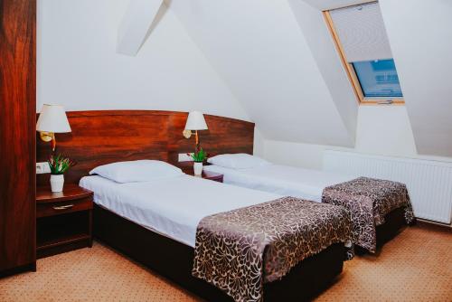 Katil atau katil-katil dalam bilik di Hotel Korel