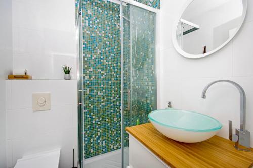 a bathroom with a sink and a glass shower at Manuela in Podstrana