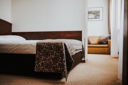 Postel nebo postele na pokoji v ubytování Hotel Korel