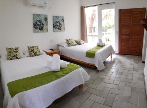 Säng eller sängar i ett rum på Coral House San Andres
