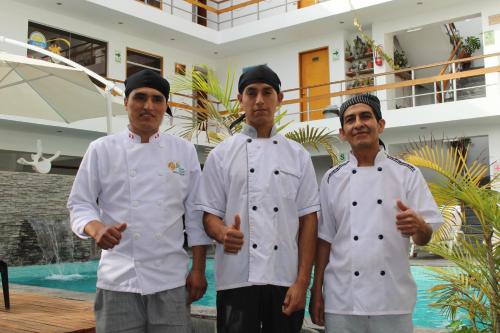 three men in white chefsuits giving the thumbs up at Hotel Miramar in Huarmey