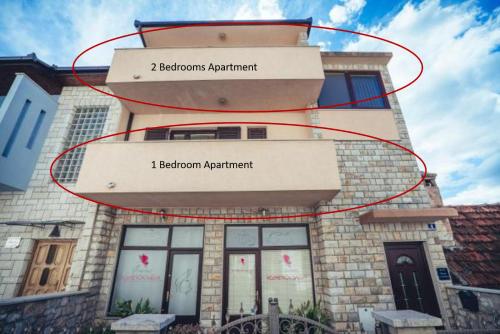 a building with a sign that reads electron apartment at Ivica Apartments in Imotski