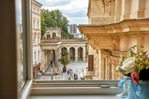 a view of a city street from a window at Golden Key Boutique Hotel in Karlovy Vary