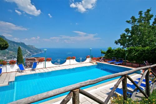 a swimming pool with a view of the ocean at Villa Casale Ravello Residence in Ravello