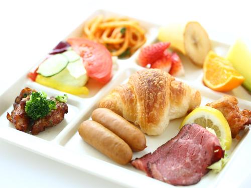 a plate of food with different types of food at Chino Sky View Hotel in Chino