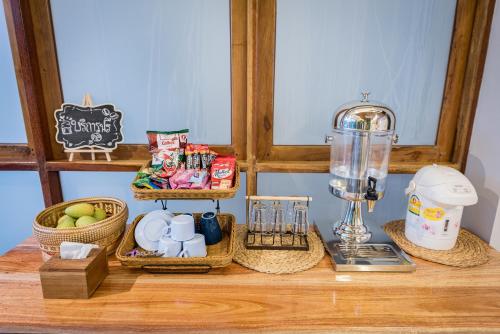 a counter with baskets of food and a blender at U Chiangkhan in Chiang Khan