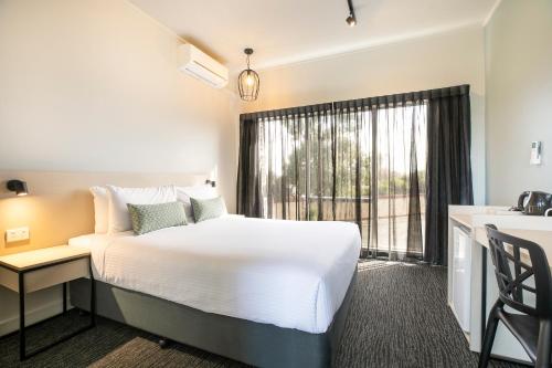 Katil atau katil-katil dalam bilik di Nightcap at Excelsior Hotel