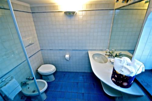 a bathroom with a sink and a toilet at Villa Casale Ravello Residence in Ravello