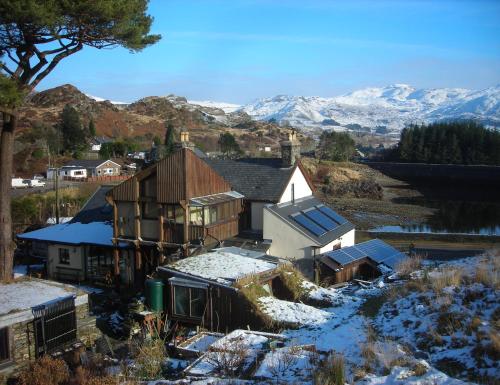 an aerial view of a house in the snow at Bryn Elltyd Eco House in Blaenau-Ffestiniog
