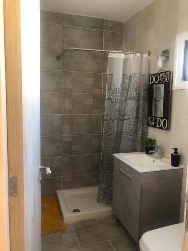 a bathroom with a shower and a sink at AgiaNapaNest studio in Ayia Napa