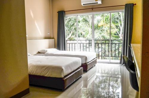 Cama ou camas em um quarto em Chiangdaoplace