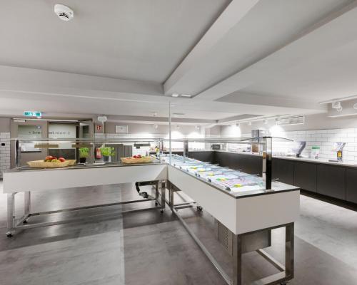 a kitchen filled with lots of counter space at a&o Frankfurt Galluswarte in Frankfurt