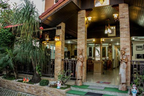 a building with statues in the front of it at Iyara Hua Hin Lodge in Hua Hin