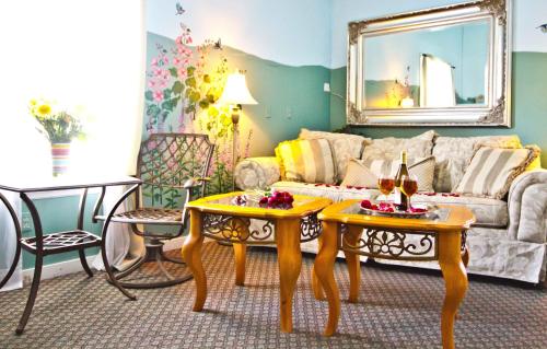 a living room with a couch and a table at Elk Forge Bed and Breakfast in Elkton
