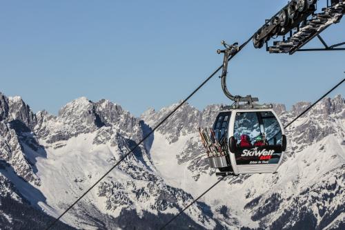 a ski lift over a snowy mountain at Chalet Tirol in Westendorf