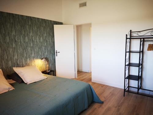 a bedroom with a bed and a book shelf at Mas Puig in Saint-Genis-des-Fontaines