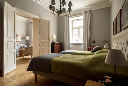 En eller flere senger på et rom på Belle Epoque Residence