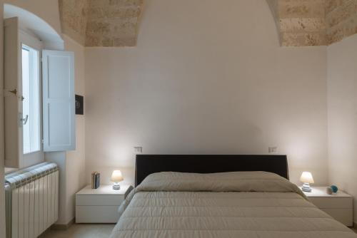 Voodi või voodid majutusasutuse Isabella Apartment by Wonderful Italy toas