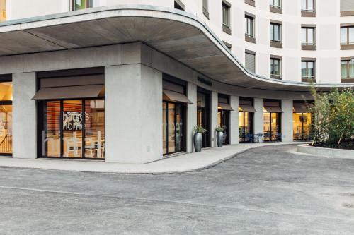 a facade of a building with a building at harry's home Zürich-Wallisellen in Wallisellen