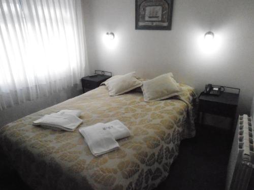 Una cama o camas en una habitación de Hosteria Posada Drake