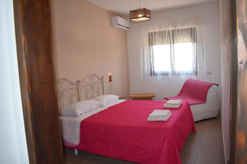 A bed or beds in a room at Da Mesciu Nzinu