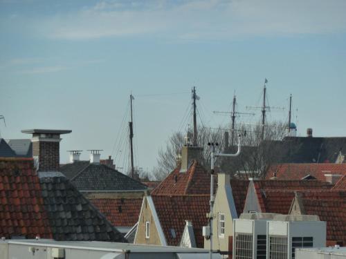 a view of a city with roofs at Hotel Centraal in Harlingen