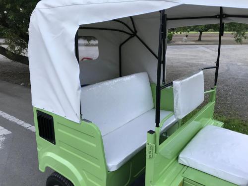 a green and white golf cart with two seats at Tuktuk House in Kawagoe