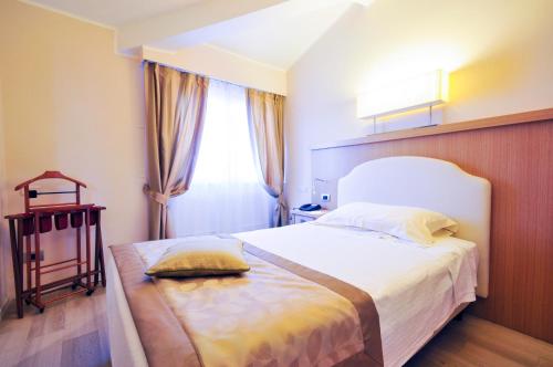 Cama o camas de una habitación en Hotel Sirmione