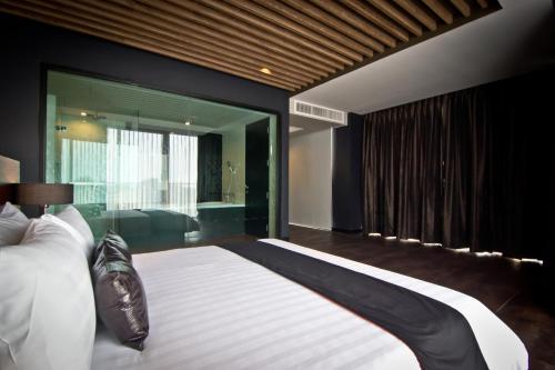 Tsix5 Hotel tesisinde bir odada yatak veya yataklar