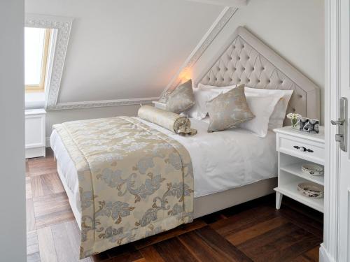 a bedroom with a large bed with a large headboard at Nexthouse Pera Hotel in Istanbul