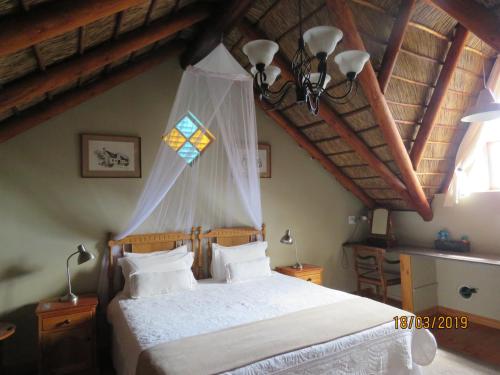 Tempat tidur dalam kamar di Karoo-Rust