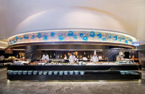 a restaurant kitchen with a large counter top at Grand Hi Lai Hotel in Kaohsiung