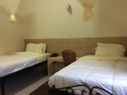 Un pat sau paturi într-o cameră la Tita Tourist Resort